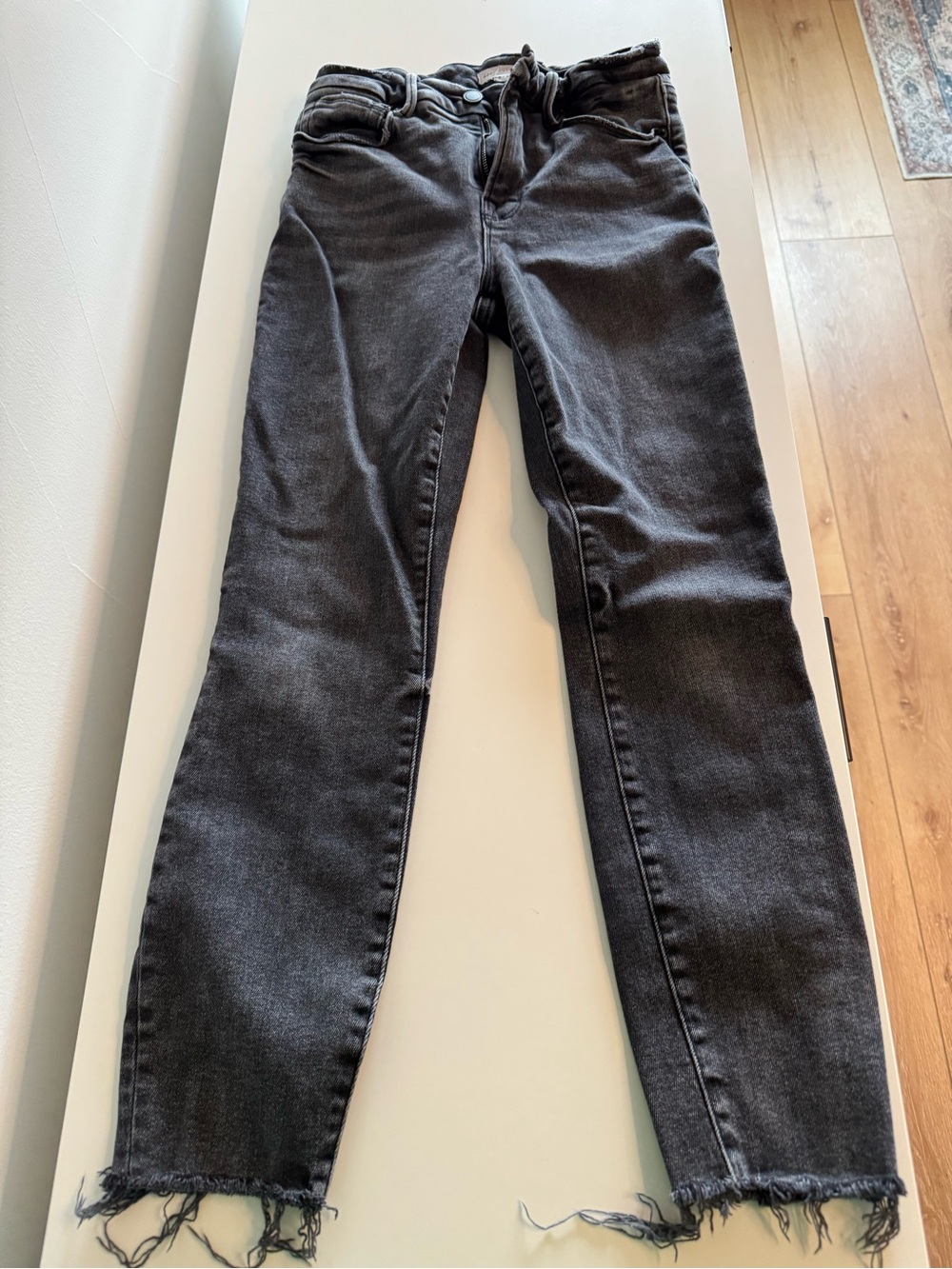Good American Black Washed Ankle Jeans with Frayed Hem